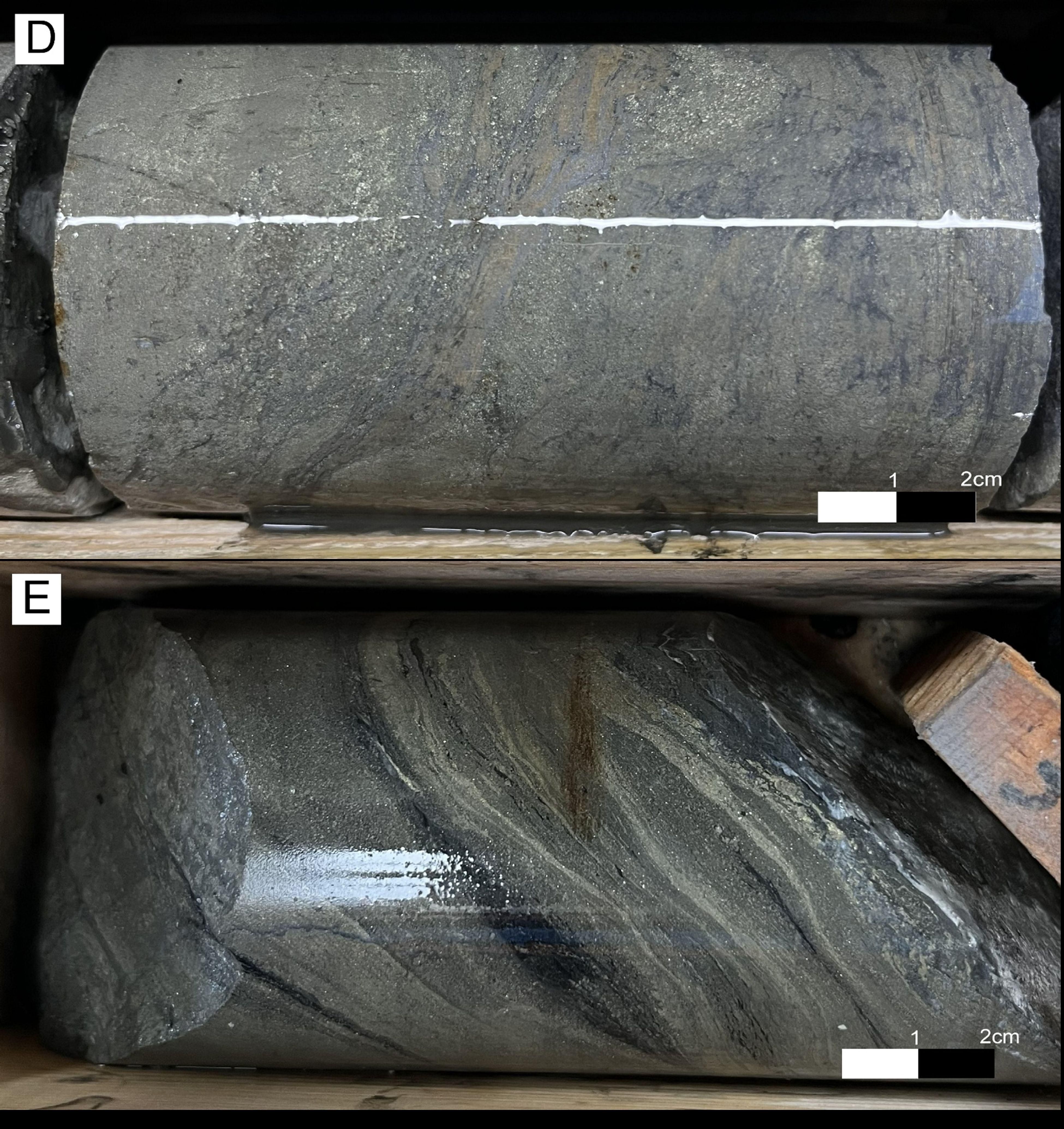 Photos of El Cura drillcore: D: EC079 massive sulphide with pyritic matrix and milimetric sphalerite/galena rich veinlets within some chalcopyrite in millimetric crystals. E: EC082 pyritic rich massive suphide with chalcopyrite in millimetric veinlets.